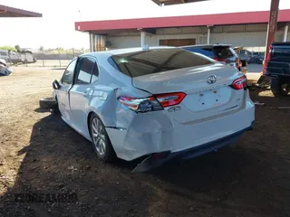 2020 Toyota Camry LE with VIN 4T1C11AK7LU401666, listed as a IAAI auction lot 41865235 with 69,189 mi miles. Bid and sale history available at carsss.com. Image 3.