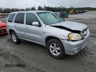 2006 Mazda Tribute i with VIN 4F2YZ02Z26KM14821, listed as a Copart auction lot 71718434 with 318,841 mi miles and Salvage Title. Bid and sale history available at carsss.com. Image 4.