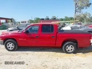 2000 Dodge Dakota Sport with VIN 1B7GL2AX0YS685498, listed as a IAAI auction lot 42069753 with 56,269 mi miles and . Bid and sale history available at DreamBid. Image 14.
