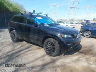 2018 Jeep Grand Cherokee Laredo E with VIN 1C4RJFAG2JC320441, listed as a IAAI auction lot 42095419 with 136,962 mi miles. Bid and sale history available at carsss.com. Image 1.