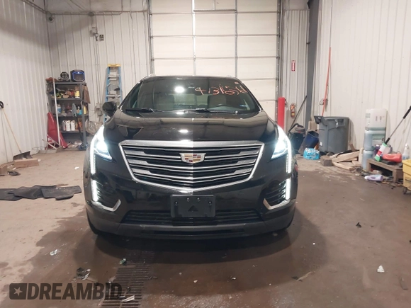 2019 Cadillac XT5 Premium Luxury AWD z VIN 1GYKNFRSXKZ189590, wystawiony jako IAAI lot #41316561 z przebiegiem 98 755 mil mil oraz . Historia ofert i sprzedaży dostępna na DreamBid. Obrazek 13.