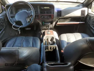 1998 Jeep Grand Cherokee Limited z VIN 1J4GZ88Z1WC231772, wystawiony jako Copart lot #55697775 z przebiegiem 178 896 mil mil oraz Czysty tytuł • Clean title. Historia ofert i sprzedaży dostępna na DreamBid. Obrazek 8.