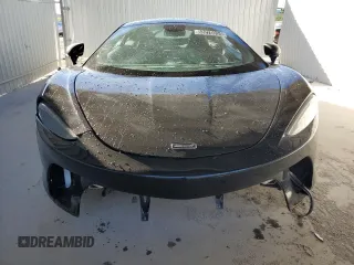 2022 McLaren GT z VIN SBM22GCA4NW001602, wystawiony jako Copart lot #83270334 z przebiegiem 33 668 mil mil oraz Tytuł czysty. Historia ofert i sprzedaży dostępna na DreamBid. Obrazek 5.