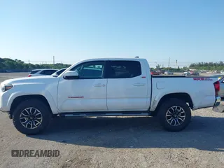 2018 Toyota Tacoma SR with VIN 5TFAX5GN2JX128621, listed as a IAAI auction lot 41797514 with 216,251 mi miles and . Bid and sale history available at DreamBid. Image 14.