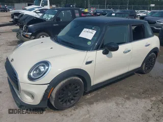 2020 MINI Hardtop 4 Door Cooper with VIN WMWXU7C01L2M54710, listed as a IAAI auction lot 42385956 with 55,714 mi miles and . Bid and sale history available at DreamBid. Image 2.