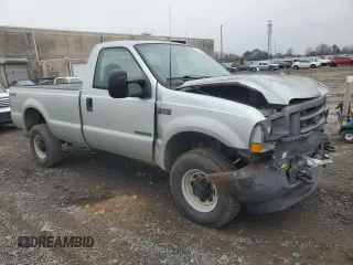 2002 Ford F-350 XL with VIN 1FTSF31F12EB21069, listed as a Copart auction lot 84287374 with 110,890 mi miles and Salvage Title. Bid and sale history available at DreamBid. Image 4.