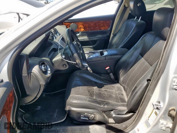 2012 Jaguar XJ with VIN SAJWA1CB0CLV23002, listed as a Copart auction lot 52804915 with 149,331 mi miles and Salvage title. Bid and sale history available at DreamBid. Image 7.