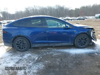 2022 Tesla Model X Plaid z VIN 7SAXCBE69NF343318, wystawiony jako IAAI lot #41387403 z przebiegiem Nie podano mil oraz . Historia ofert i sprzedaży dostępna na DreamBid. Obrazek 13.