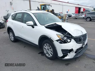 2016 Mazda CX-5 Sport with VIN JM3KE4BY7G0764563, listed as a IAAI auction lot 42279993 with 128,950 mi miles and . Bid and sale history available at DreamBid. Image 1.