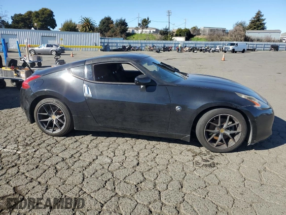 2012 Nissan 370Z Touring with VIN JN1AZ4EH4CM561432, listed as a Copart auction lot 89376935 with 128,955 mi miles and Salvage Title. Bid and sale history available at carsss.com. Image 4.