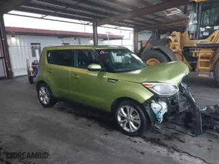 2014 Kia Soul + with VIN KNDJP3A58E7039624, listed as a IAAI auction lot 41953648 with 92,801 mi miles. Bid and sale history available at carsss.com. Image 1.