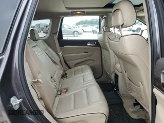 2014 Jeep Grand Cherokee Overland with VIN 1C4RJFCG9EC572237, listed as a Copart auction lot 53864865 with 90,657 mi miles and Salvage Title. Bid and sale history available at DreamBid. Image 11.