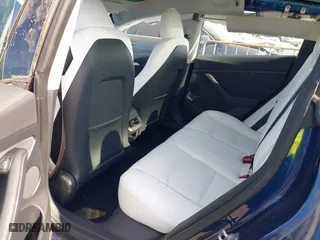 2023 Tesla Model 3 with VIN 5YJ3E1EA9PF697573, listed as a IAAI auction lot 41173833 with 6,966 mi miles. Bid and sale history available at carsss.com. Image 8.