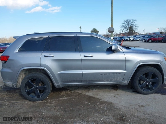 2015 Jeep Grand Cherokee Altitude with VIN 1C4RJFAG3FC210151, listed as a IAAI auction lot 41865151 with 122,579 mi miles. Bid and sale history available at carsss.com. Image 13.