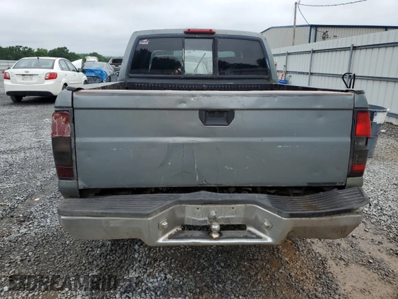 2000 Nissan Frontier XE with VIN 1N6ED27T2YC311037, listed as a Copart auction lot 57901285 with Not provided miles and Salvage title. Bid and sale history available at DreamBid. Image 6.