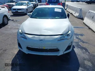 2015 Scion FR-S with VIN JF1ZNAA12F9709707, listed as a IAAI auction lot 41545940 with 107,575 mi miles. Bid and sale history available at carsss.com. Image 6.