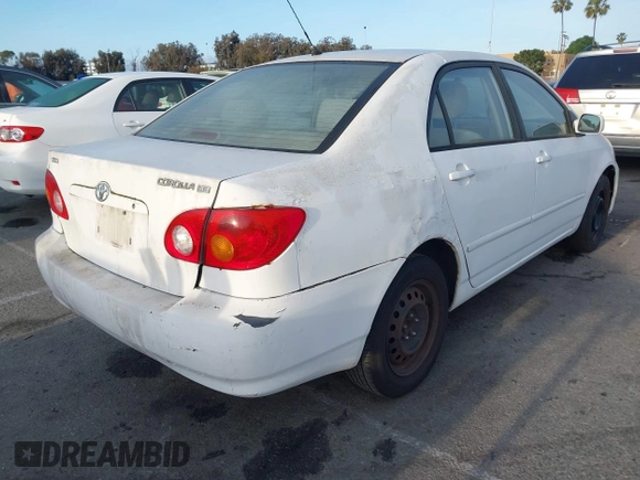 2004 Toyota Corolla CE with VIN JTDBR32E042025208, listed as a IAAI auction lot 41934485 with 299,999 mi miles. Bid and sale history available at carsss.com. Image 4.
