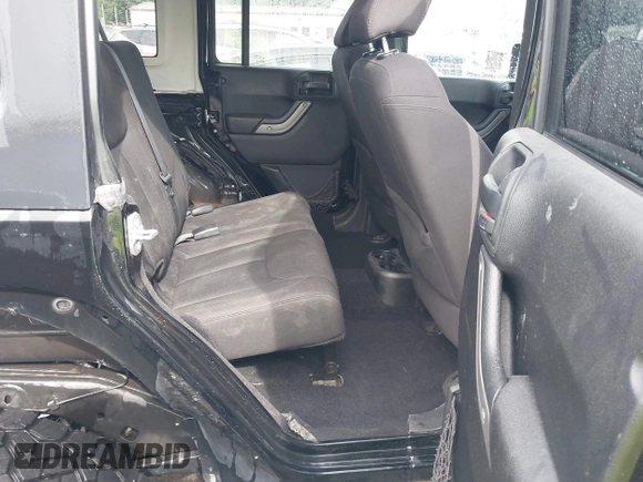 2015 Jeep Wrangler Unlimited Willys Wheeler with VIN 1C4BJWDG4FL687829, listed as a IAAI auction lot 42099147 with 98,969 mi miles and . Bid and sale history available at DreamBid. Image 8.