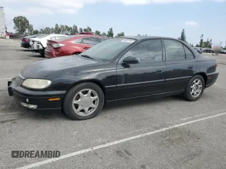 1997 Cadillac Catera z VIN W06VR52RXVR092016, wystawiony jako Copart lot #54067575 z przebiegiem 63 978 mil mil oraz Tytuł czysty. Historia ofert i sprzedaży dostępna na DreamBid. Obrazek 1.