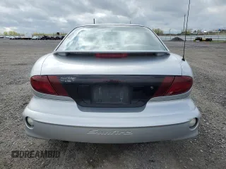 2002 Pontiac Sunfire SE z VIN 1G2JB124927312790, wystawiony jako Copart lot #55923795 z przebiegiem 106 983 mil mil oraz Tytuł czysty. Historia ofert i sprzedaży dostępna na DreamBid. Obrazek 6.