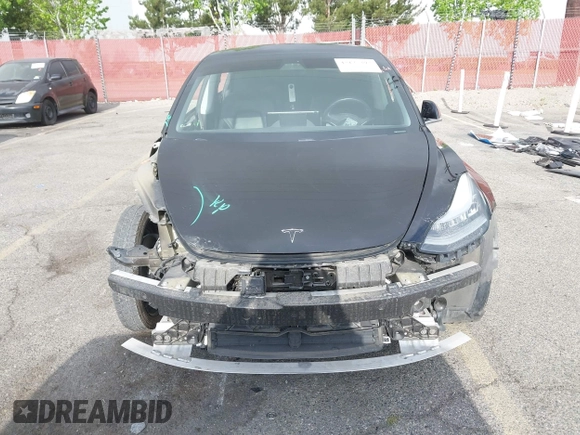 2019 Tesla Model 3 Mid Range with VIN 5YJ3E1EA3KF415601, listed as a IAAI auction lot 42125393 with 150,220 mi miles and . Bid and sale history available at carsss.com. Image 6.
