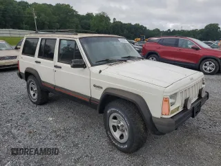 1996 Jeep Cherokee Sport z VIN 1J4FJ68S3TL103684, wystawiony jako Copart lot #63466265 z przebiegiem 163 715 mil mil oraz Czysty tytuł • Clean title. Historia ofert i sprzedaży dostępna na DreamBid. Obrazek 4.