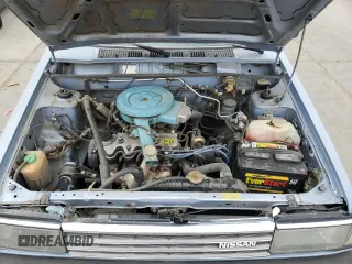 1985 Nissan Sentra z VIN JN1PB15S6FU172045, wystawiony jako Copart lot #54384475 z przebiegiem 134 117 mil mil oraz Szkody całkowita. Historia ofert i sprzedaży dostępna na DreamBid. Obrazek 11.