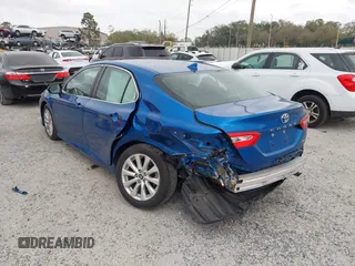 2020 Toyota Camry LE with VIN 4T1L11AK5LU310671, listed as a IAAI auction lot 41732306 with 61,379 mi miles and . Bid and sale history available at carsss.com. Image 3.