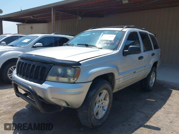 2004 Jeep Grand Cherokee Laredo with VIN 1J4GW48S74C260968, listed as a IAAI auction lot 42050628 with 192,602 mi miles. Bid and sale history available at carsss.com. Image 2.