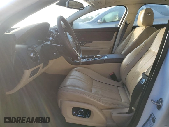 2016 Jaguar XJ with VIN SAJWA1CE4GMV91734, listed as a Copart auction lot 81005144 with 31,924 mi miles and Salvage Title. Bid and sale history available at DreamBid. Image 7.