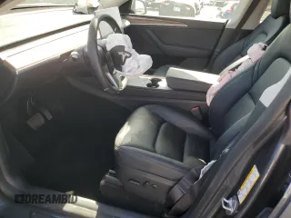 2023 Tesla Model Y Long Range z VIN 7SAYGDEE7PF822934, wystawiony jako Copart lot #49285285 z przebiegiem Nie podano mil oraz Szkoda całkowita • Salvage title. Historia ofert i sprzedaży dostępna na DreamBid. Obrazek 7.
