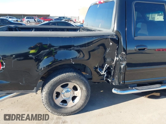 2002 Ford F-150 XLT with VIN 1FTRW07622KD31203, listed as a IAAI auction lot 41401506 with 166,949 mi miles. Bid and sale history available at carsss.com. Image 6.