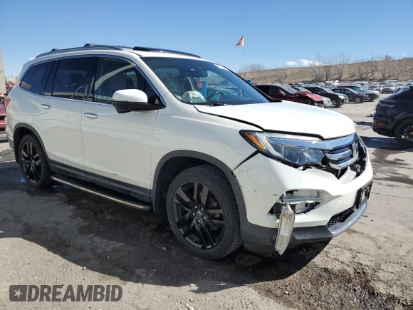 2017 Honda Pilot Touring with VIN 5FNYF6H91HB007611, listed as a Copart auction lot 47217175 with 107,349 mi miles and Salvage Title. Bid and sale history available at DreamBid. Image 4.