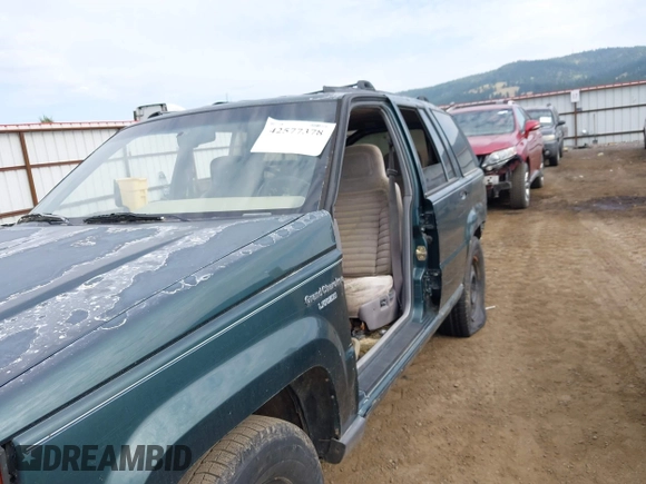 1994 Jeep Grand Cherokee Laredo with VIN 1J4GZ58S9RC215874, listed as a IAAI auction lot 42577378 with 230,824 mi miles and . Bid and sale history available at DreamBid. Image 12.