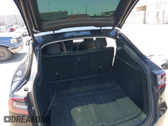 2024 Tesla Model Y with VIN 7SAYGDED2RF040745, listed as a IAAI auction lot 41986613 with 9,778 mi miles and . Bid and sale history available at DreamBid. Image 19.