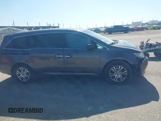 2012 Honda Odyssey EX-L with VIN 5FNRL5H61CB095789, listed as a IAAI auction lot 42065507 with 138,570 mi miles and . Bid and sale history available at DreamBid. Image 13.