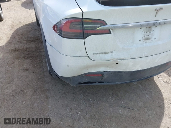 2018 Tesla Model X 75D with VIN 5YJXCBE27JF121834, listed as a IAAI auction lot 41769246 with 90,814 mi miles and . Bid and sale history available at carsss.com. Image 6.