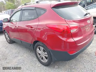 2012 Hyundai Tucson Limited with VIN KM8JU3ACXCU345113, listed as a IAAI auction lot 41946239 with 173,007 mi miles. Bid and sale history available at carsss.com. Image 3.
