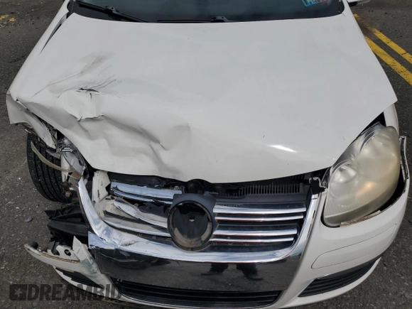 2009 Volkswagen Jetta SE z VIN 3VWRM71K39M057367, wystawiony jako Copart lot #58745235 z przebiegiem 130 647 mil mil oraz Szkoda całkowita • Salvage title. Historia ofert i sprzedaży dostępna na DreamBid. Obrazek 11.