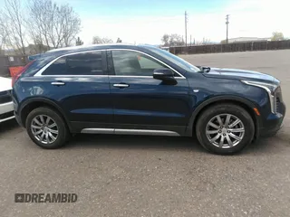 2021 Cadillac XT4 FWD Premium Luxury with VIN 1GYFZCR48MF004009, listed as a IAAI auction lot 41956723 with 82,483 mi miles. Bid and sale history available at carsss.com. Image 13.