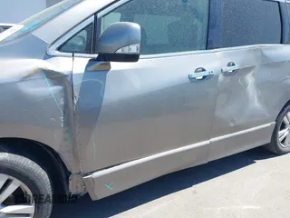 2013 Nissan Quest LE z VIN JN8AE2KPXD9069232, wystawiony jako IAAI lot #42101529 z przebiegiem 250 544 mil mil oraz . Historia ofert i sprzedaży dostępna na DreamBid. Obrazek 6.