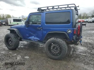 2009 Jeep Wrangler X with VIN 1J4FA24179L700884, listed as a Copart auction lot 52194055 with 96,189 mi miles and Salvage Title. Bid and sale history available at DreamBid. Image 2.