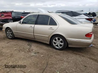 2002 Mercedes-Benz E-Class with VIN WDBJF65J12B463150, listed as a Copart auction lot 74434654 with 215,883 mi miles and Salvage Title. Bid and sale history available at carsss.com. Image 2.