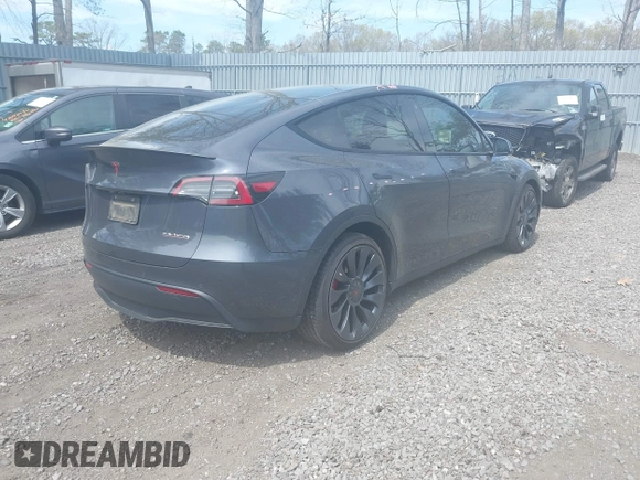 2022 Tesla Model Y Performance with VIN 7SAYGDEF3NF324705, listed as a IAAI auction lot 42076565 with 66,573 mi miles and . Bid and sale history available at DreamBid. Image 4.