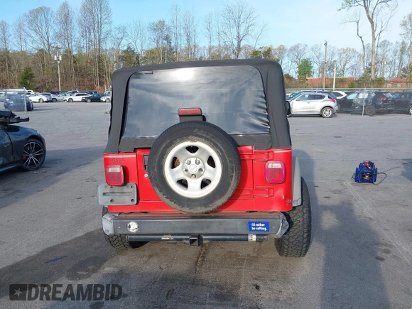 2003 Jeep Wrangler Sport with VIN 1J4FA49S13P320159, listed as a IAAI auction lot 41935699 with 212,355 mi miles. Bid and sale history available at carsss.com. Image 16.