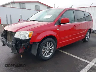 2014 Dodge Grand Caravan SXT with VIN 2C4RDGCG3ER257695, listed as a IAAI auction lot 41534568 with 116,896 mi miles and . Bid and sale history available at DreamBid. Image 2.