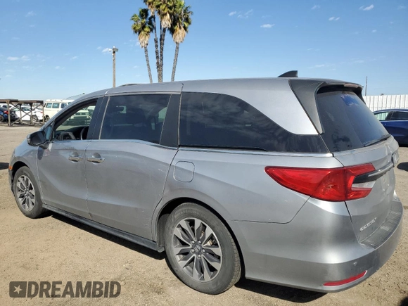 2021 Honda Odyssey EX-L with VIN 5FNRL6H77MB011099, listed as a Copart auction lot 47412535 with 148,004 mi miles and Salvage Title. Bid and sale history available at DreamBid. Image 2.