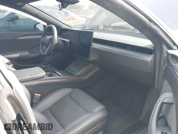 2023 Tesla Model S with VIN 5YJSA1E53PF510757, listed as a IAAI auction lot 42075624 with Not provided miles and . Bid and sale history available at DreamBid. Image 5.