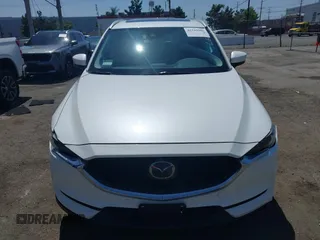 2020 Mazda CX-5 Grand Touring with VIN JM3KFADM9L0821930, listed as a IAAI auction lot 42549986 with 29,929 mi miles and . Bid and sale history available at DreamBid. Image 12.