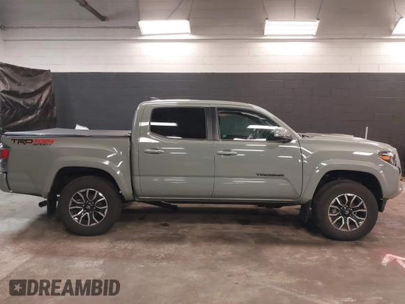 2023 Toyota Tacoma 4WD SR with VIN 3TMCZ5ANXPM607489, listed as a IAAI auction lot 41605018 with 15,229 mi miles. Bid and sale history available at carsss.com. Image 13.